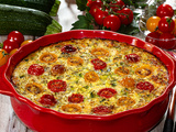 Clafoutis aux tomates cerises, courgettes et fromage de chèvre frais