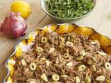 Epaule d’agneau confite aux fruits secs, olives et citron